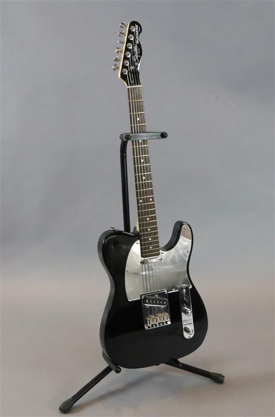 A Squire Fender Telecaster standard series, gloss black with hard case